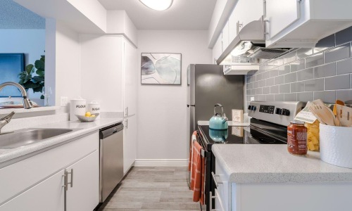 a kitchen with white cabinets