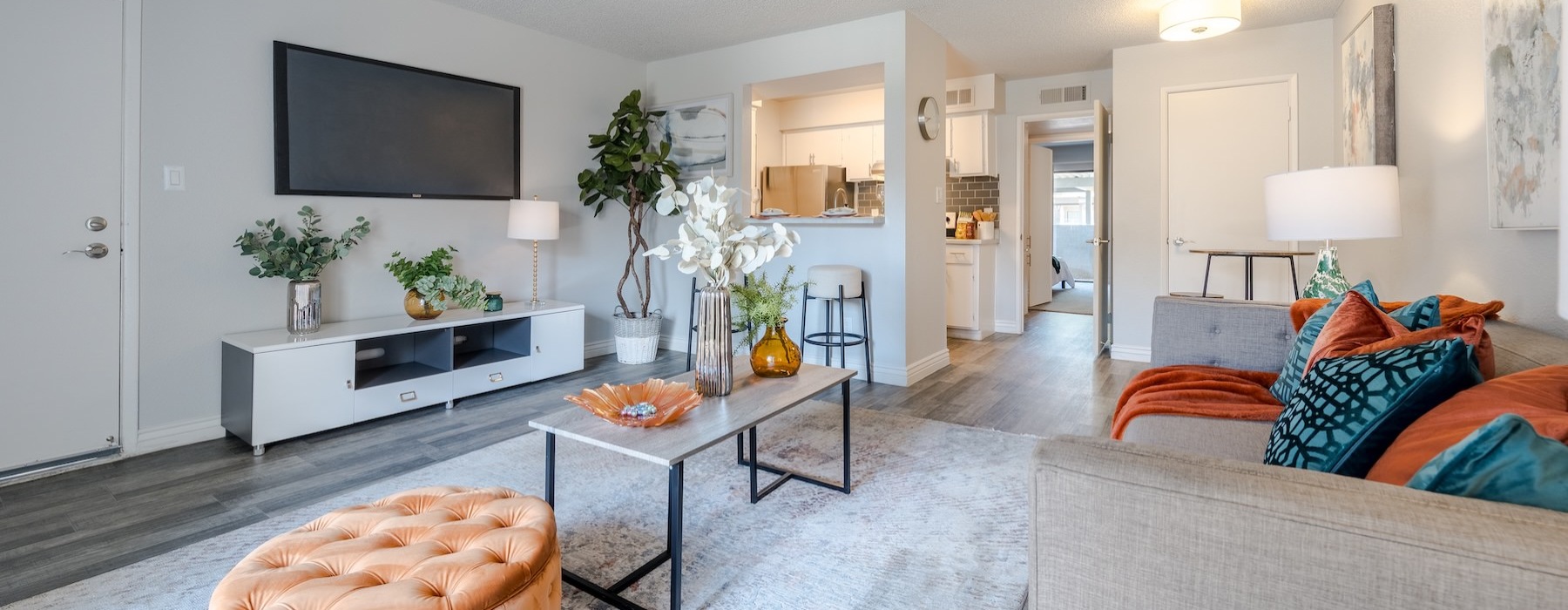 a living room with a tv and couches